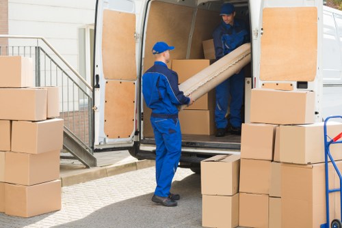 Removal team planning a house move in Belgravia with packing materials and furniture protection