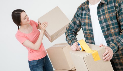Removal van and moving crew near elegant Belgravia townhouses