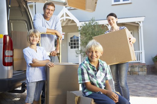 Packed boxes and furniture ready for transport in a Belgravia removal van service