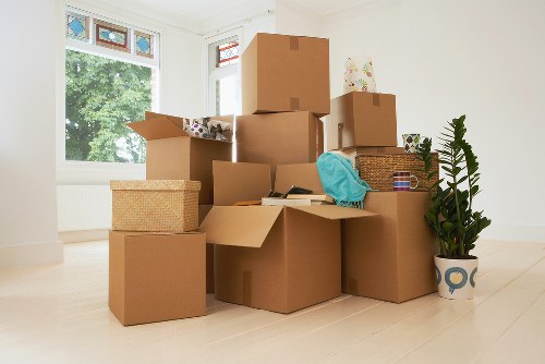Professional movers transporting home furniture in central Belgravia